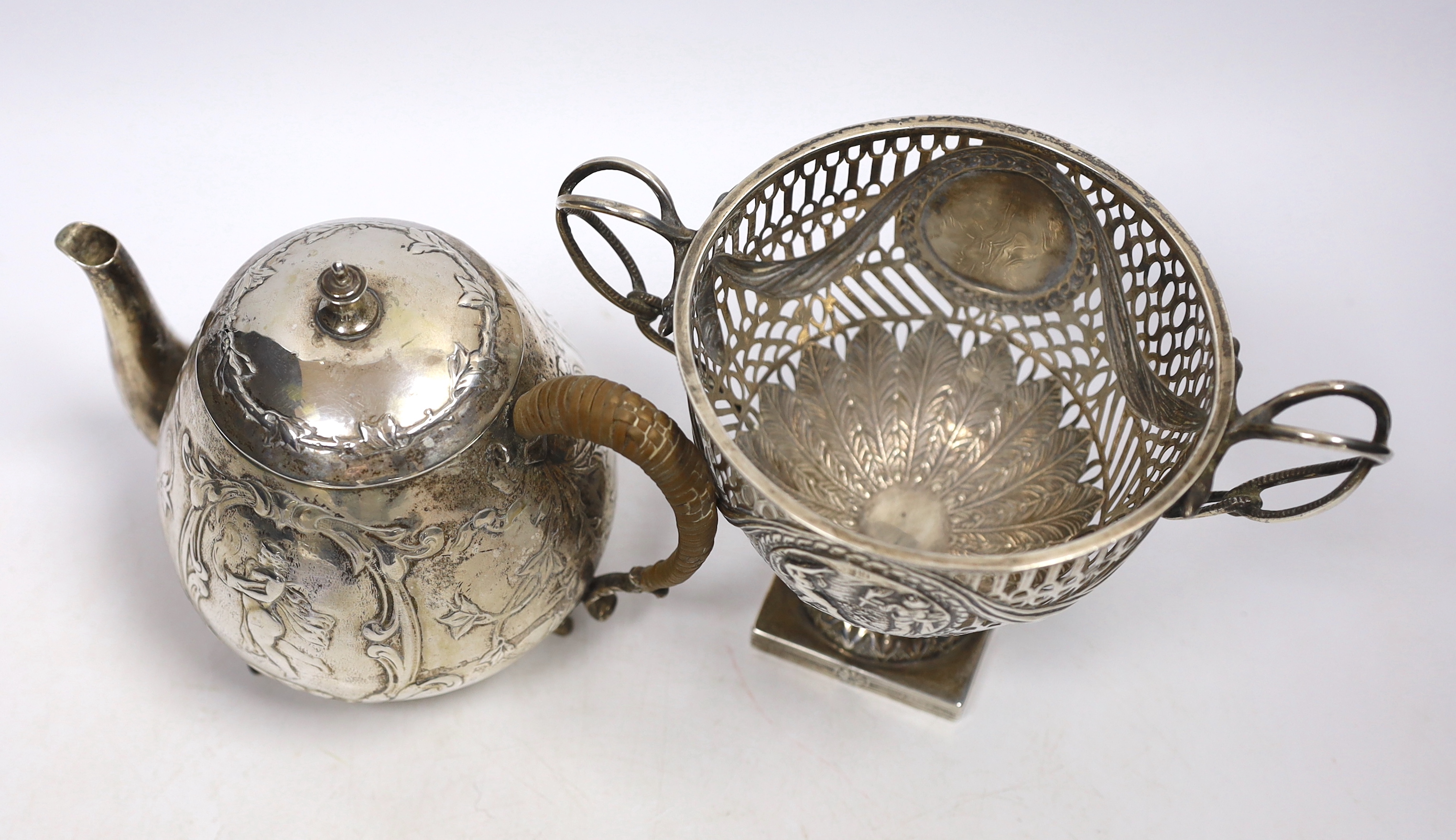 A late Victorian pierced silver neo-classical design sugar bowl, Chester 1900, 261 grams, and a 19th century Dutch silver teapot, decorated with classical figures and scrolls, gross 392 grams